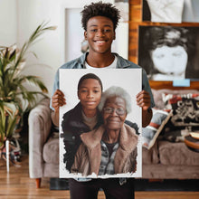 Load image into Gallery viewer, Custom art canvas wrap depicting a young black boy posing for a picture with his grandparent grandmother grandma. The custom artwork canvas wrap is being held and shown off by the same black boy now a college student and he is smiling at the camera while displaying his custom art canvas wrap.
